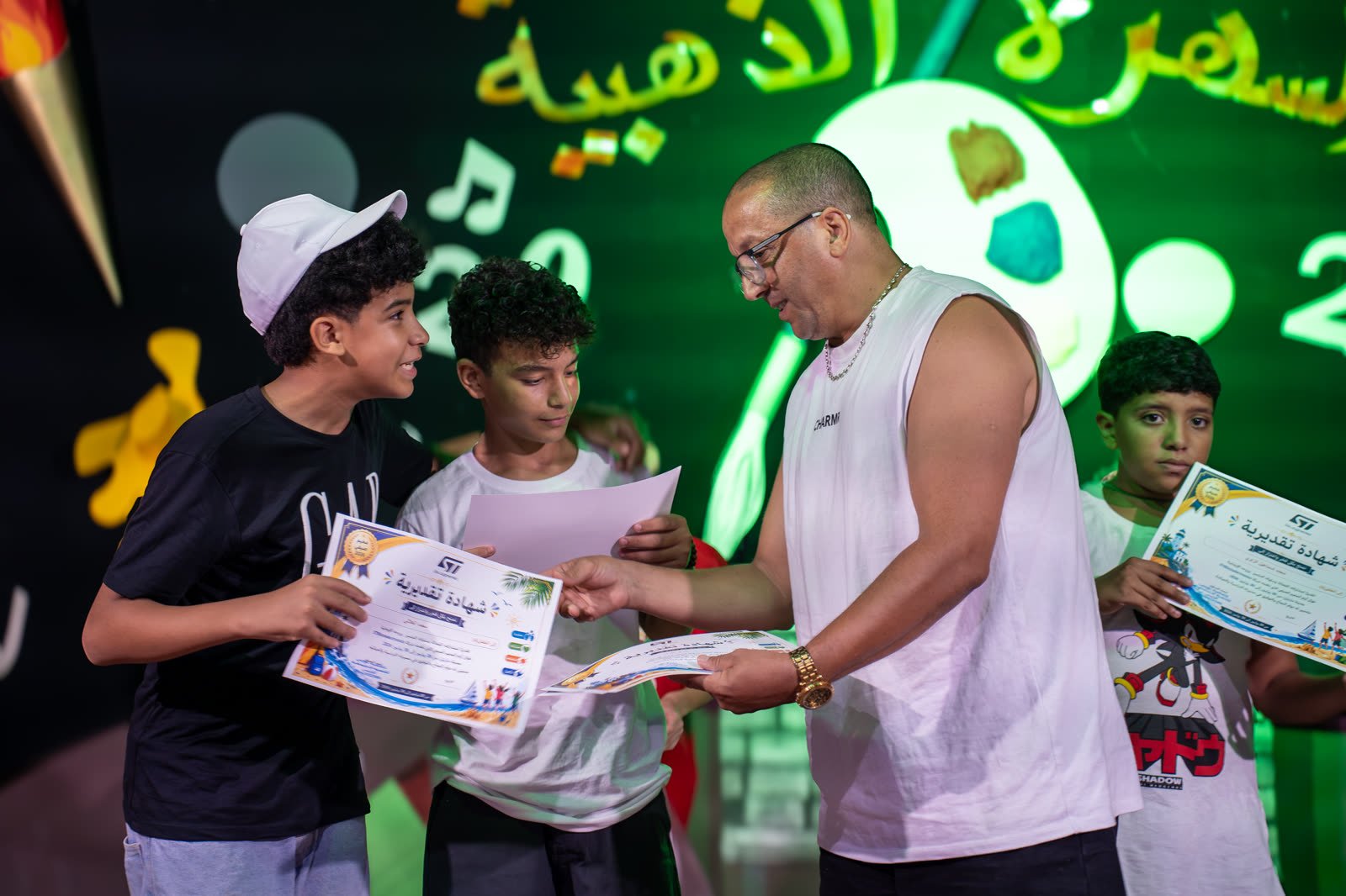 Boys receiving certificates on closing night
